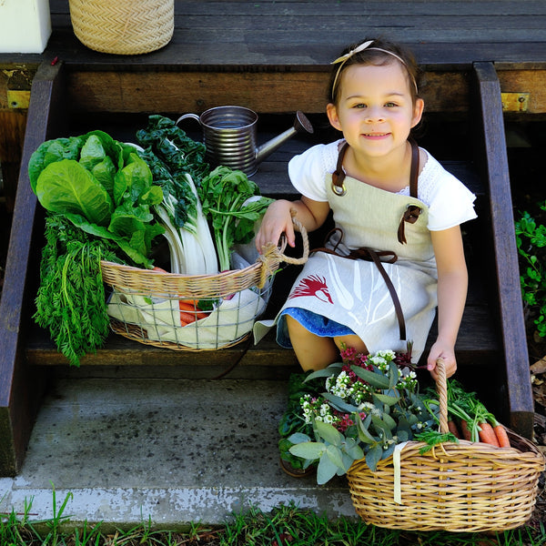 100% linen hand screen printed red and white gum nut kids apron with leather straps by Krystol Brailey Designs