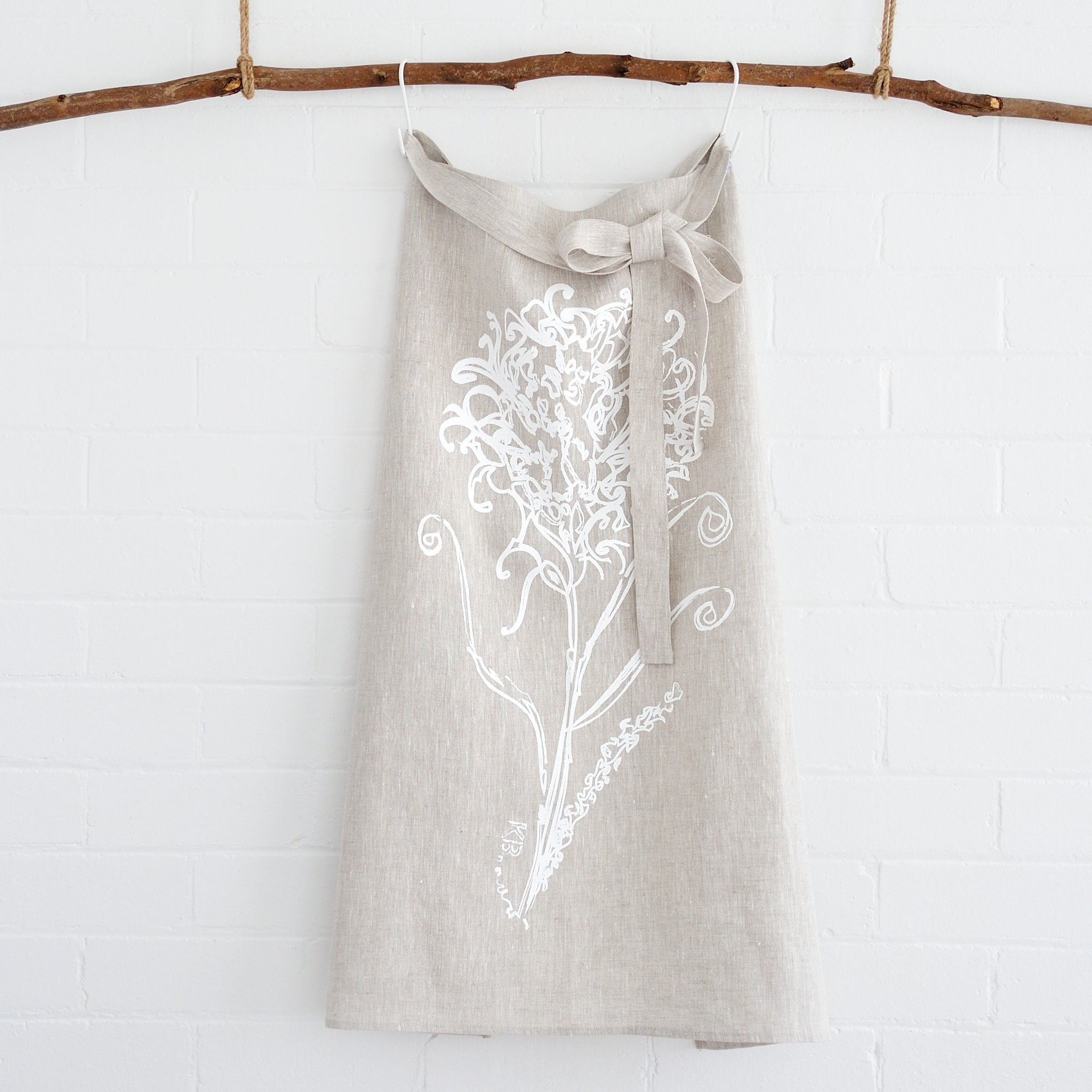 100% linen hand screen printed white waratah cafe style apron by Krystol Brailey Designs